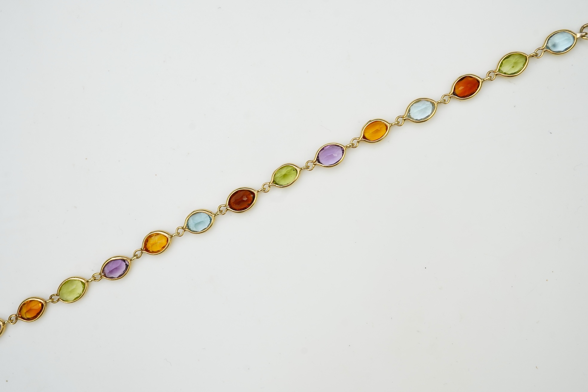A gold and gem-set bracelet
